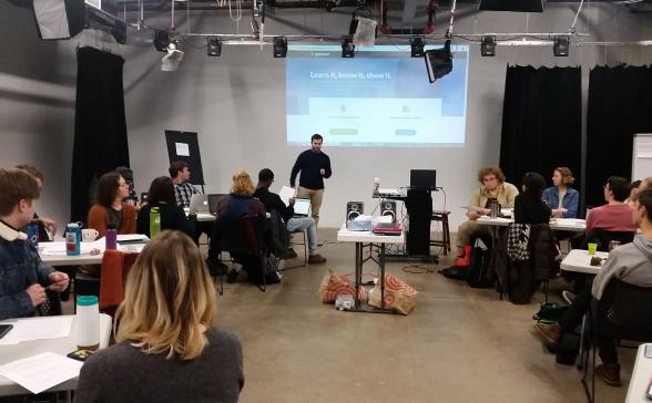 A person presenting a slideshow to an audience.