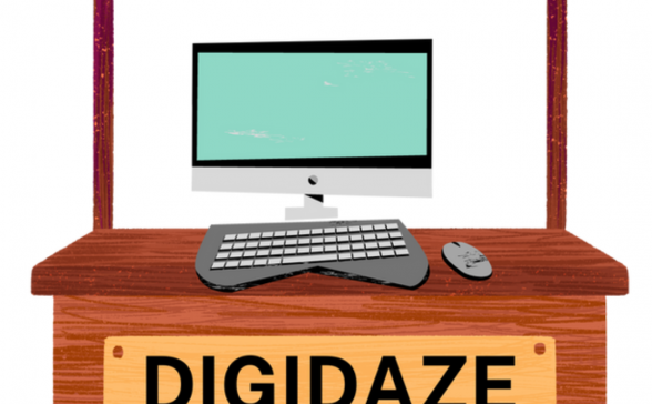 Desktop computer on a booth with a sign that reads DigiDaze Community Technology Fair