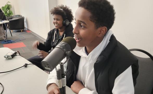 two youth recording their podcast