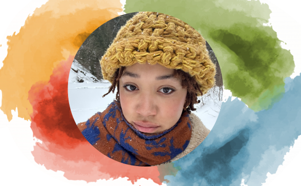 A photo of Sabrina with the SPNN colors behind her