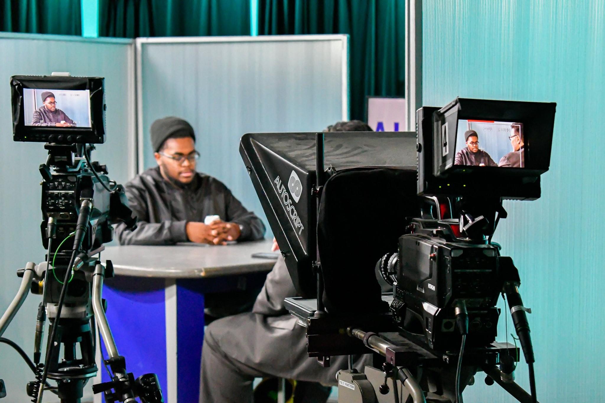 a photo of the studio with two cameras and a table.